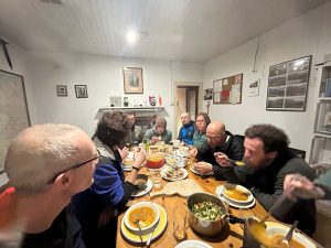 People enjoynig communal meal in Ling Hut