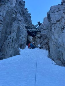 Lee belaying below the plane in fuselage gully, Beinn Eighe
