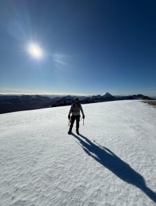 Higgy on sunny wineter day at the top of Beinn Eighe with Liathac in the background