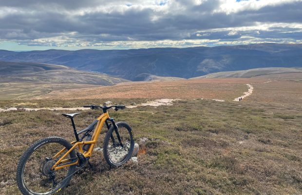 Neil's E Orbea on top of Mount Keen